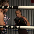 Woman training with HERfight boxing gloves in a boxing ring