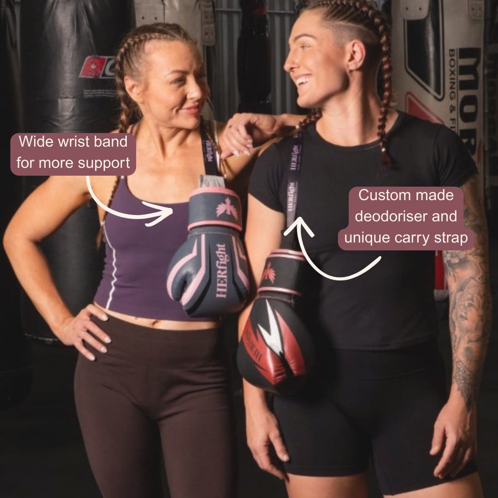 Women's boxing gloves in use during heavy bag training